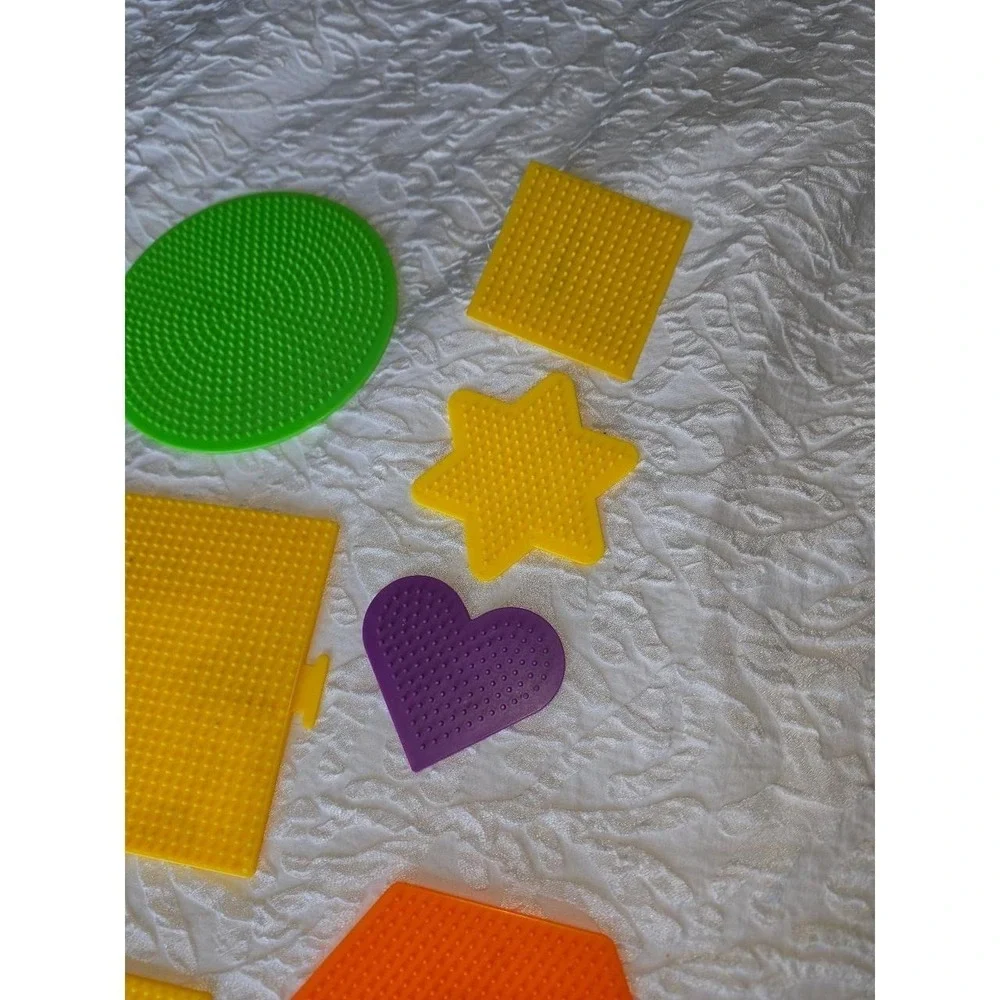 Lot D Perler bead pegboards in various shapes and bright colors